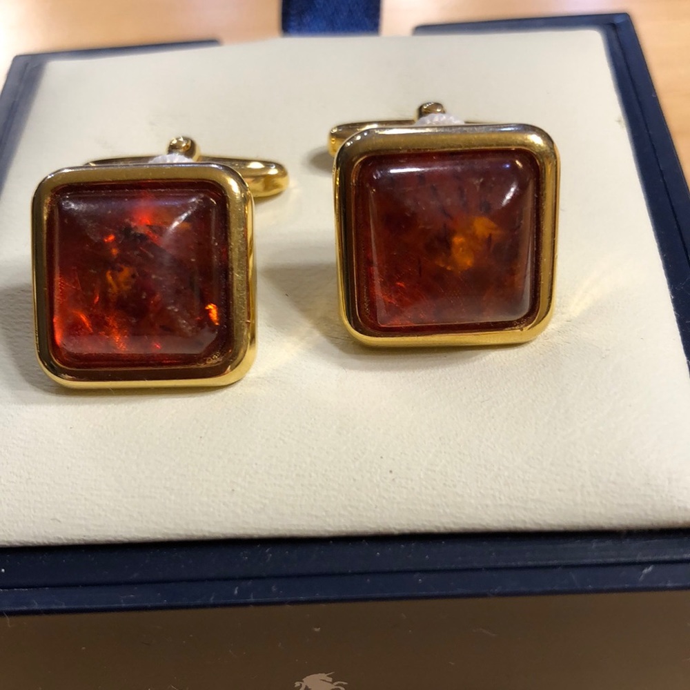 Italian made cufflinks with a faux jewel between orange/brown. Good  condition.